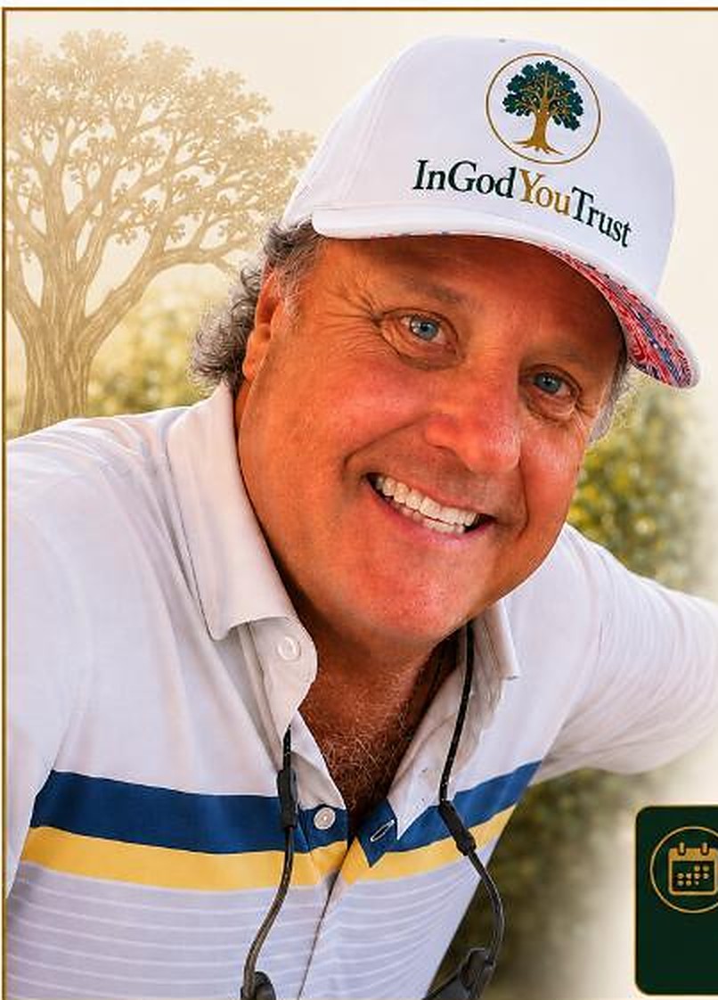 Kevin Young smiling in a white In God You Trust cap